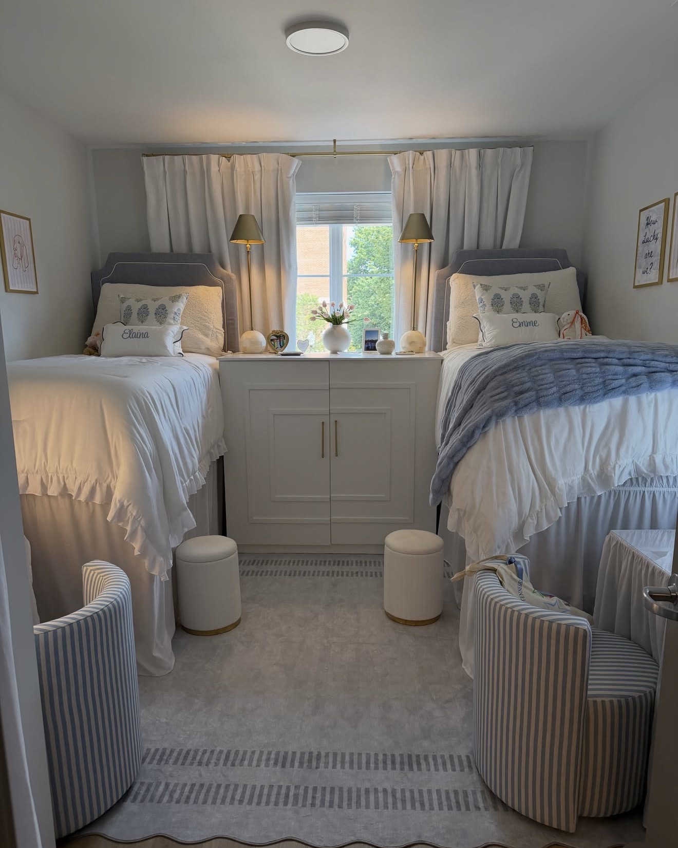Twin dorm room styled with custom headboards and drapery
